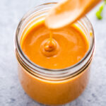 an image of vegan peanut sauce in a jar