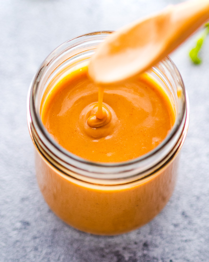 an image of vegan peanut sauce in a jar