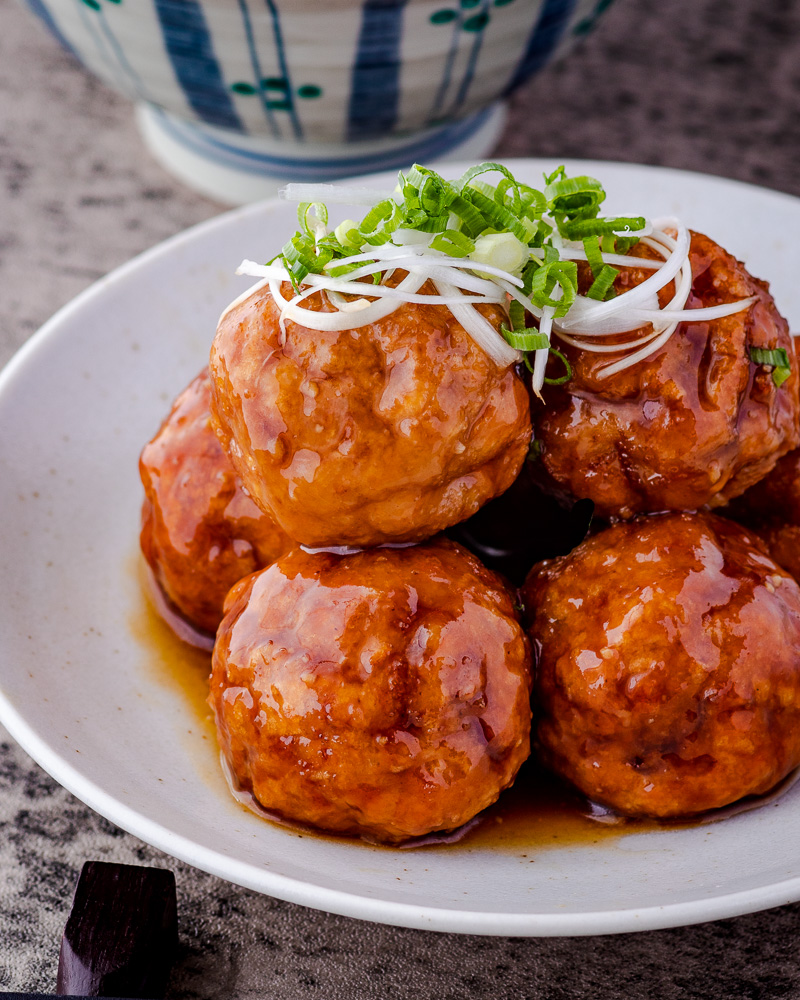 an image of vegan meatballs with sticky sauce 
