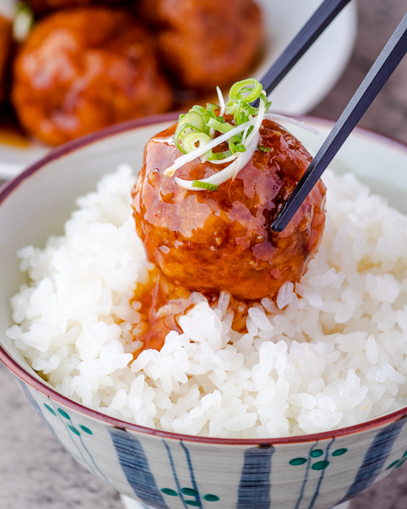 an image of vegan meatballs over bowl of rice
