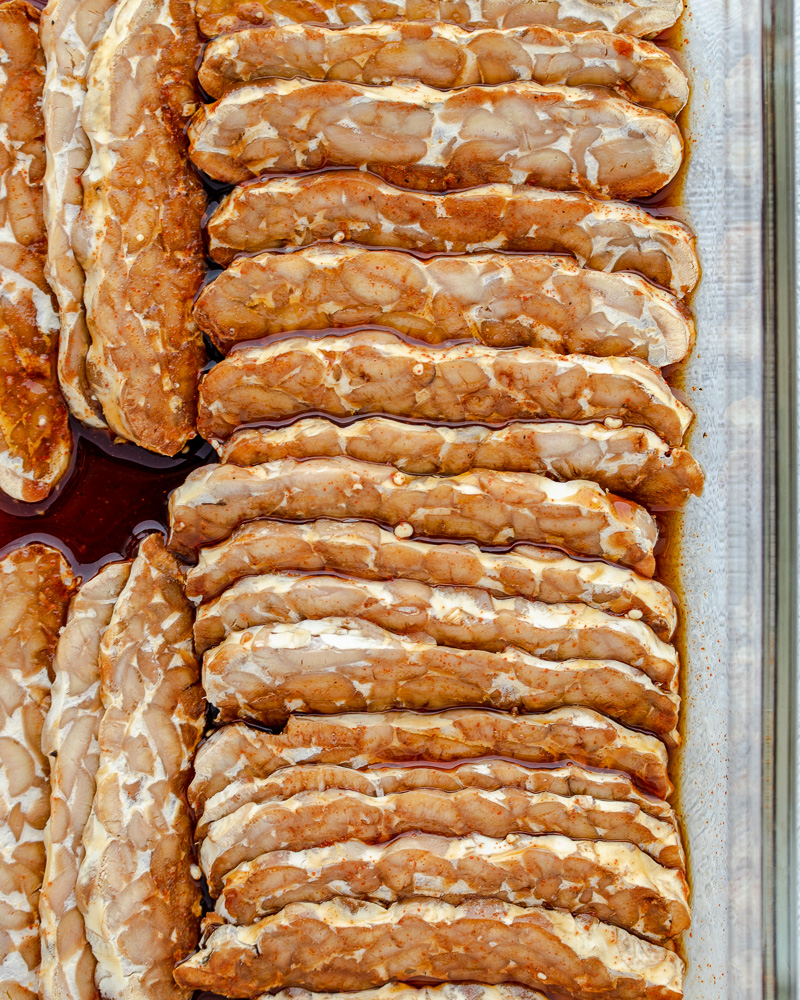 an image of sliced tempeh in marinade