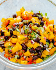 an image of mixed ingredients for mango salsa