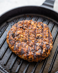 an image of black bean burger patty on a grill