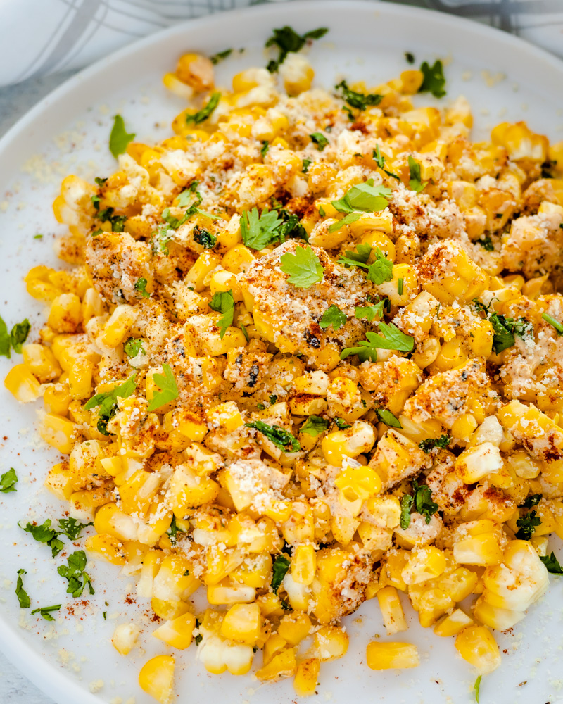 an image of vegan elote corn kernels on a plate