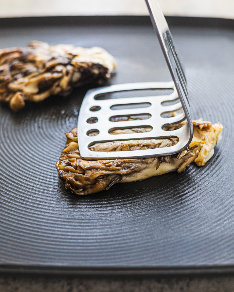 an image of maitake mushrooms in a pan