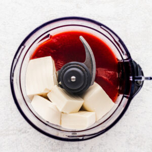 an image of silken tofu and tomato sauce in a food processor