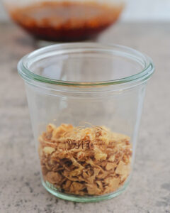 an image of fried onions and garlic in a glass jar